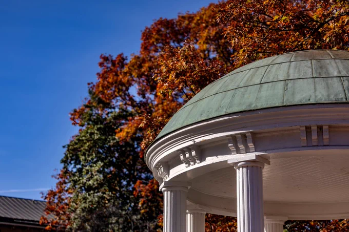 The Old Well with autumn trees behind it