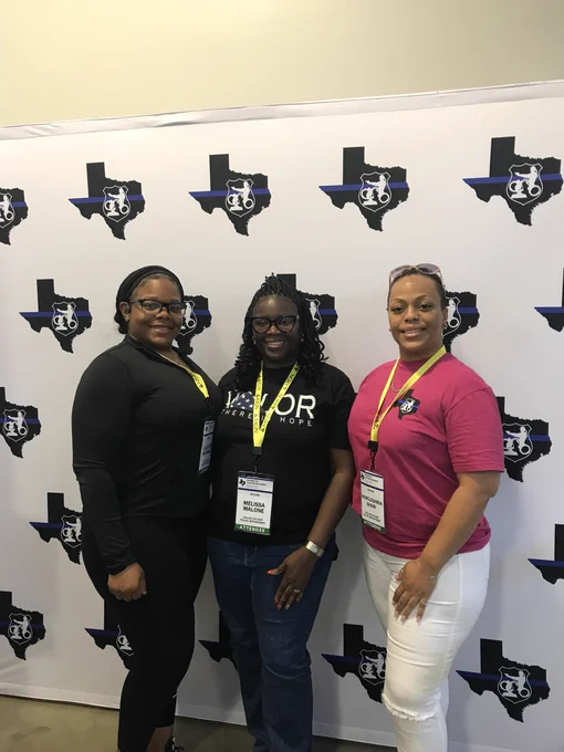 Cpl. Hashaway, Officer Malone, and Officer Shaw at the 2024 WoLE Conference.