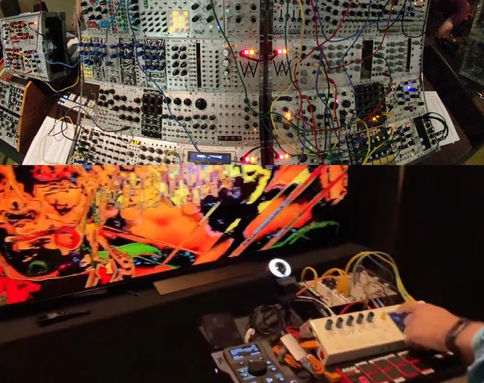 Wall of Eurorack modular, acid-tinged orange video synth output and controls