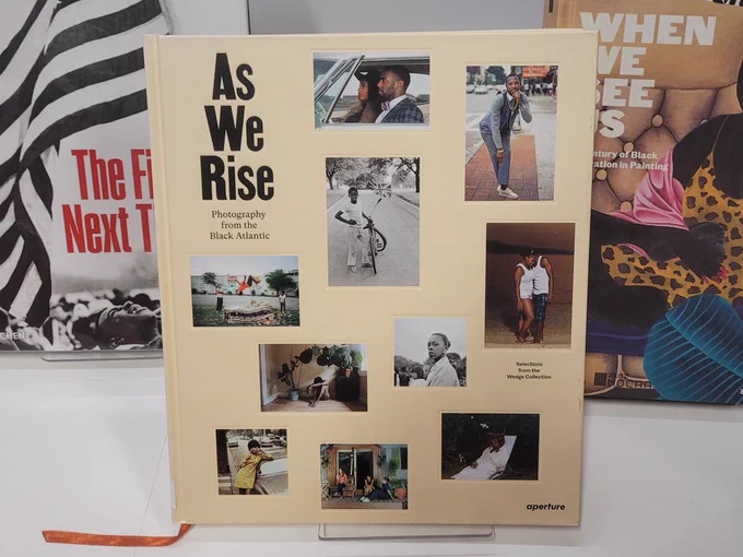 Photograph of a photography book 'As We Rise: Photography for the Black Atlantic', which is featured in the Black History Month book display at City Library.