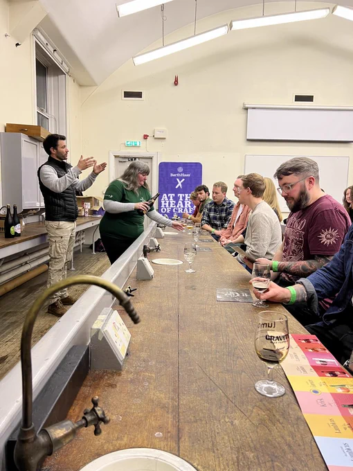 Picture of a tasting, Joanne from Barthhaas X is pouring beers into glass while a representative from Timmermans is talking
