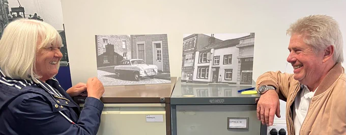 Two people discovered black and white photographs of their old house and car on display