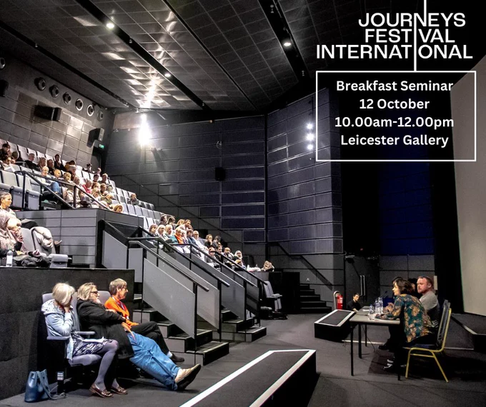 This image shows a room of people in a lecture theatre. The seating is raked and on stage there are some guest speakers. Also on the image is text that reads, 'Journeys Festival International, Breakfast Seminar, 12 October, 10.00am-12.00pm, Leicester Gallery'.