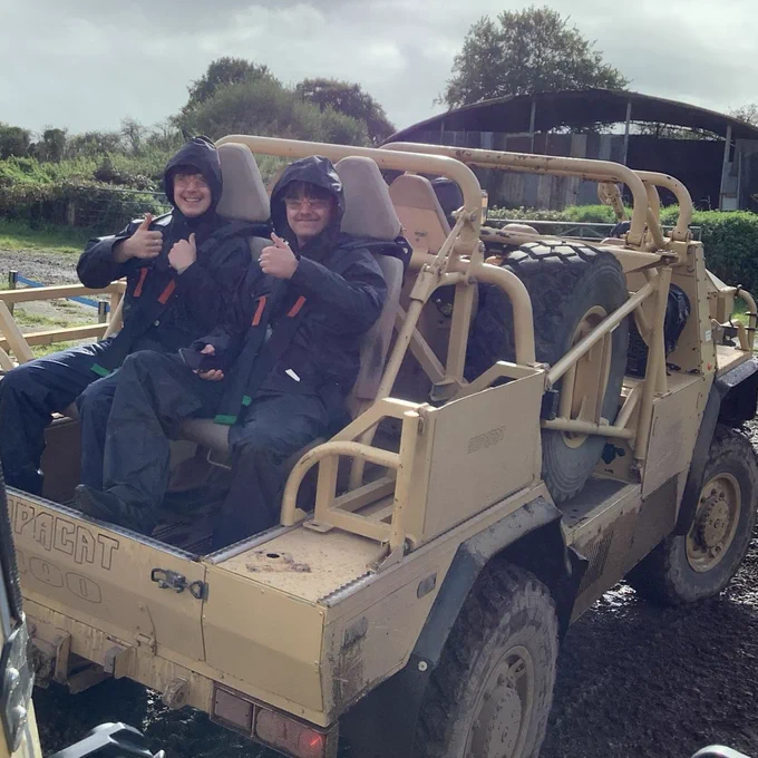 Two more students in the back of a transporter