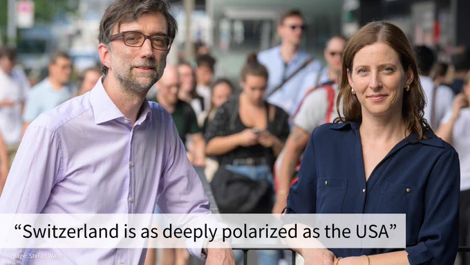 The two researchers in business casual attire are standing in front of a crowded space. Text: "Switzerland is as deeply polarized as the USA"