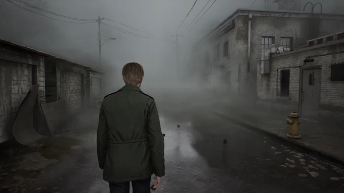 James walks a foggy street in Silent Hill 2 (2024)