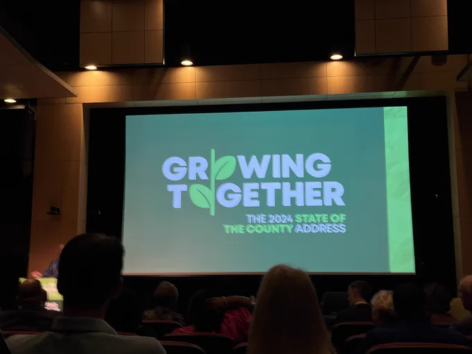 Screen that reads, "Growing Together. The 2024 State of the County Address.