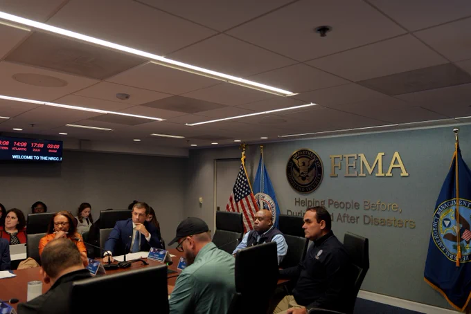 Secretary Pete Buttigieg in a conference room in a meeting at FEMA HQ.