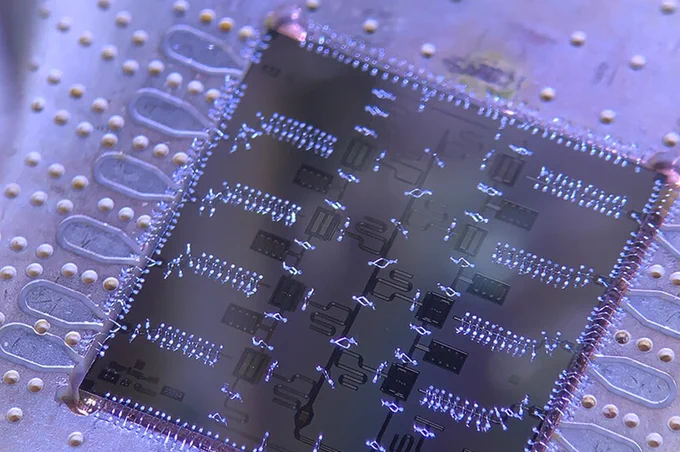 Close-up of a purple and black computer chip.
