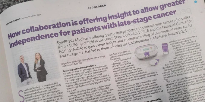 Advertisement in a newspaper showing two representatives from SymPhysis Medical with the headline 'How collaboration is offering insight to allow greater independence for patients with late-stage cancer'. Includes text and a central product image of the Medtech Award 2023.