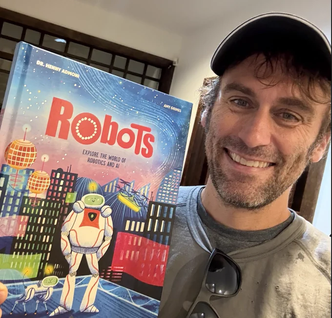 Jeff holding Henny Admoni's new book, "Robots: Explore the world of robotics and AI"