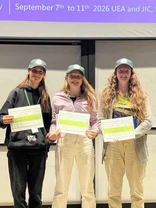 I stand holding my certificate with the women who came in 2nd and 3rd place