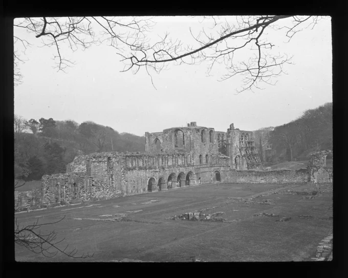 Lantern slide showing Furness Abbey with scaffolding from the renovations circa 1920s