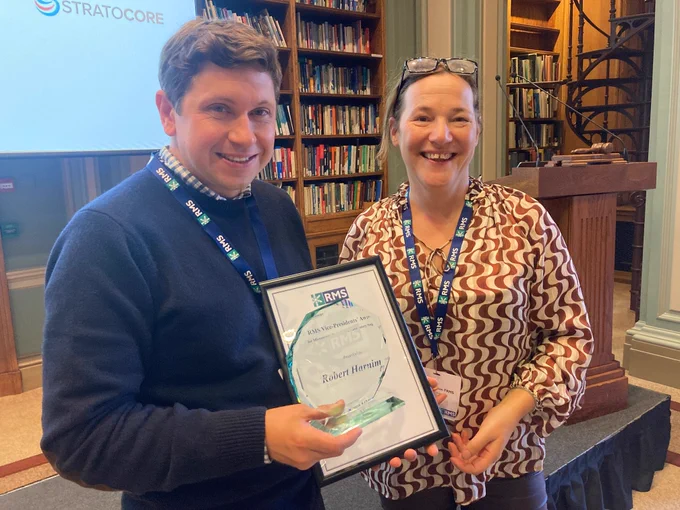 Rob Harniman (left) receives award and certificate from former RMS Vice President Susan Anderson.