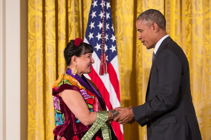 Sandra Cisneros talks with President Obama after receiving the National Medal of Arts