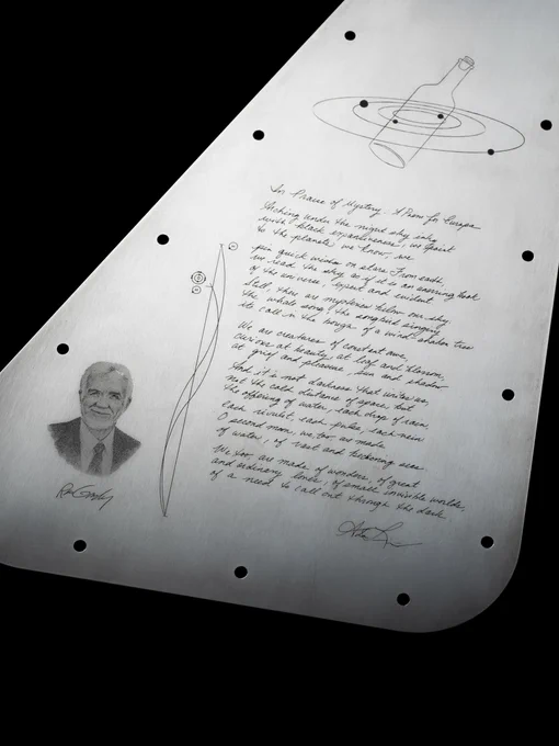 The lower half of Europa Clipper’s vault plate, showing the poem by U.S. Poet Laureate Ada Limón (lower right), a drawing representing the Jovian system that will host the names of 2.6 million people flying with mission on a microchip (top right), a tribute to planetary scientist Ron Greeley (bottom left), and the radio emission lines known a the ‘Water Hole’ (center). Credit: NASA/JPL-Caltech 