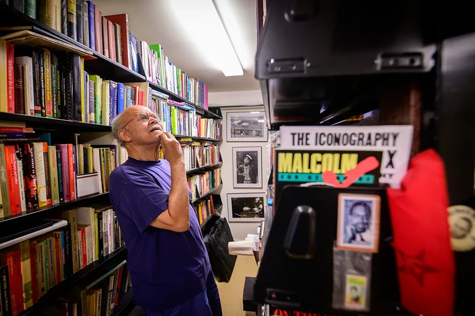 McWorter in his home library, which contains a large collection of research materials about Malcolm X.

Photo by Fred Zwicky