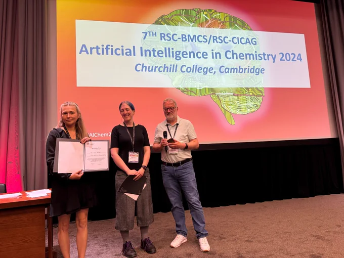 Ida Rahu receives her award from Helen Armes and Chris Swain