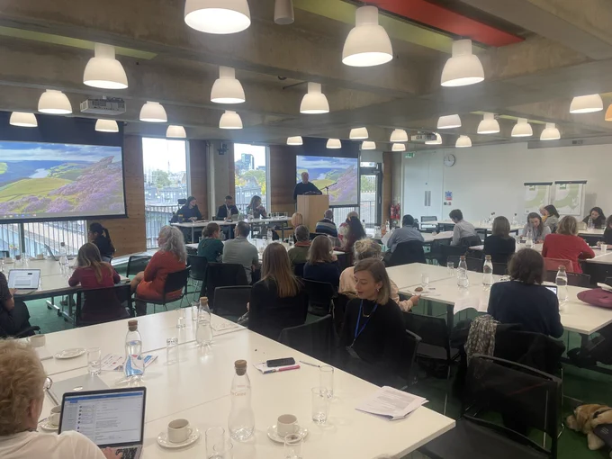 Photo of the panellists addressing the room