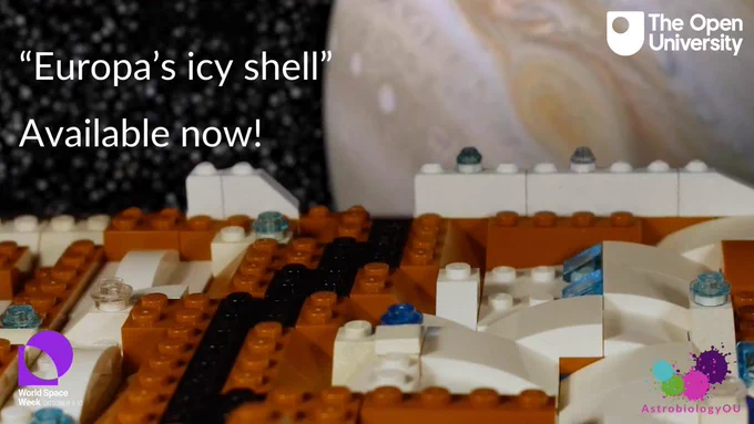 "Europa's icy shell, Available now!" on a background of the icy shell of Europa made out of Lego