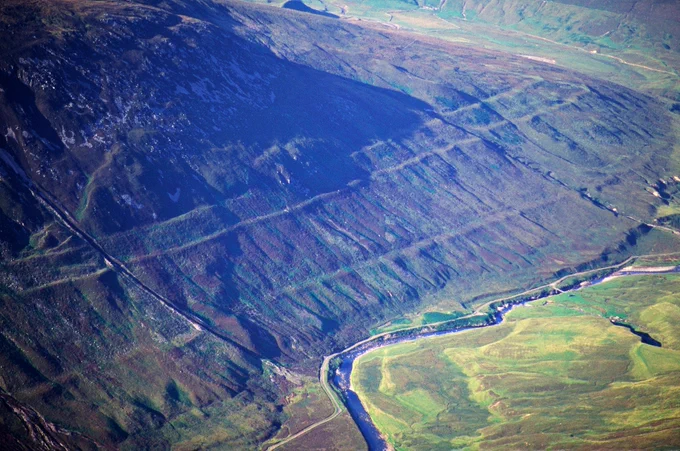 Image shows an aerial view of Glen Roy National Nature Reserve and the Parallel Roads of Lochaber Site of Scientific Interest. Research of this internationally important site, which this year became an IUGS Geological Heritage Site, helps us understand the effects of climate change and melting glaciers. Credit: Lorne Gill/NatureScot.

