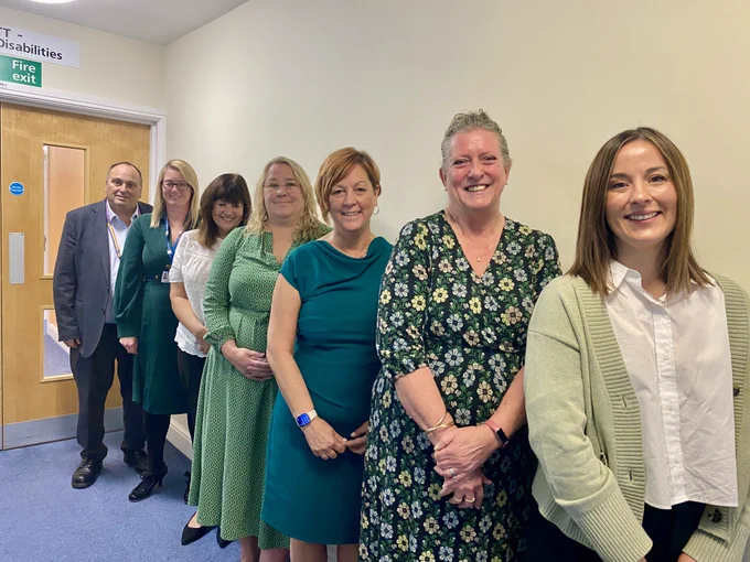 Image of some of the members of the NottsHC Executive team showing their support for Wear Green Wednesday in Freedom to Speak Up month.