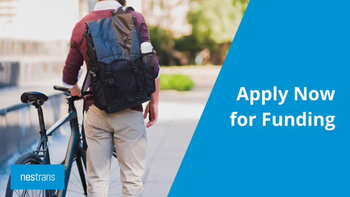 Graphic courtesy of NESTRANS.
Text:  'Apply Now for Funding' depicting a man with a rucksack walking alongside and wheeling a bicycle.