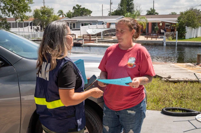 FEMA staff member registering a Helene survivor for assistance 