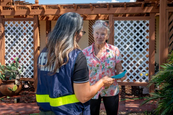 FEMA staff member registering a Helene survivor for assistance 