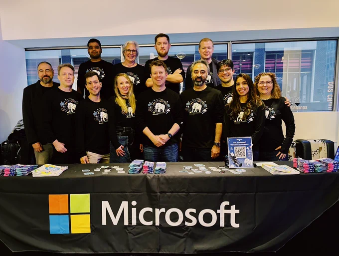 Pic of Microsoft team at their booth at PGConfNYC 2024