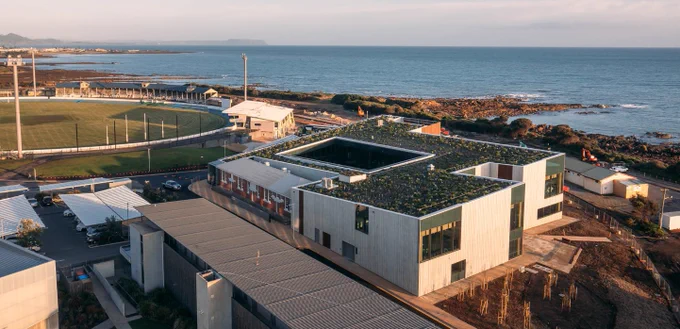 A photo of the West campus in Burnie, Tasmania with a gorgeous coastline in the background.