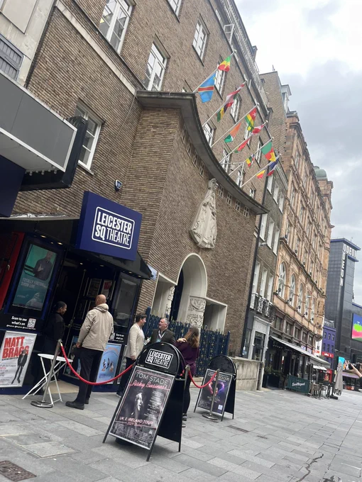 Leicester Square Theatre, a brick building with red rope outside