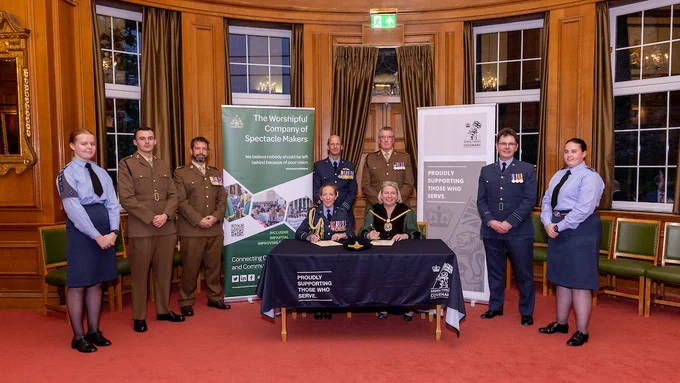 Signatories of the Armed Forces Covenant: Liz Shilling as Master, Air Commodore Sonia Phythian, Wg Cdr Phil Lucas, Maj Phil Jones, Lt Col Daniel Betts, Flt Lt Kris Cottier, Cadets Summer and Isabel and Signaller Ryan Dodson. All are in full military uniform for the signing at Barber Surgeons' Hall.