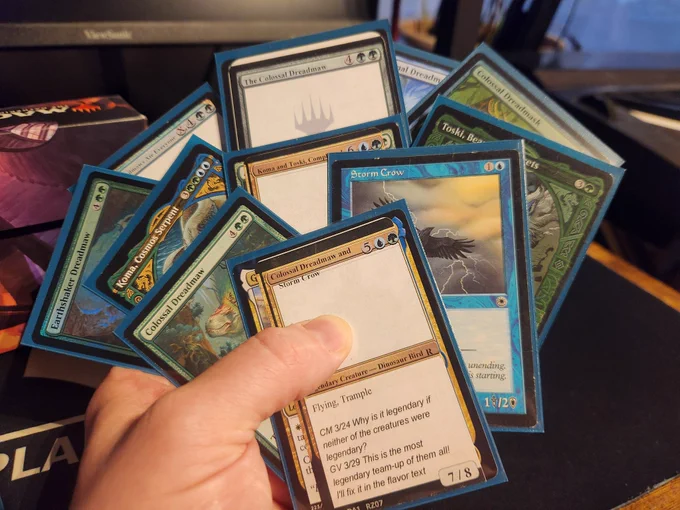 Hand of cards fanned out with Colossal Dreadmaw & Storm Crow, Colossal Dreadmaw, Storm Crow, Koma & Toski, Koma, Toski, Earthshaker Dreadmaw, Colossal Dreadmask, Phantasmal Dreadmaw, The Colossal Dreadmaw, and Then, Dreadmaws Ate Everyone