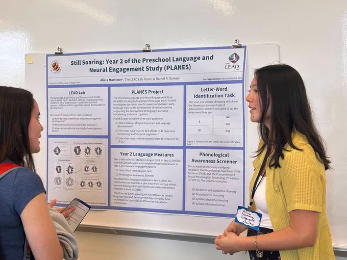 Photo of Lab Manager Alicia Mortimer presenting her poster "Still Soaring: Year 2 of the Preschool Language and Neural Engagement Study (PLANES). 