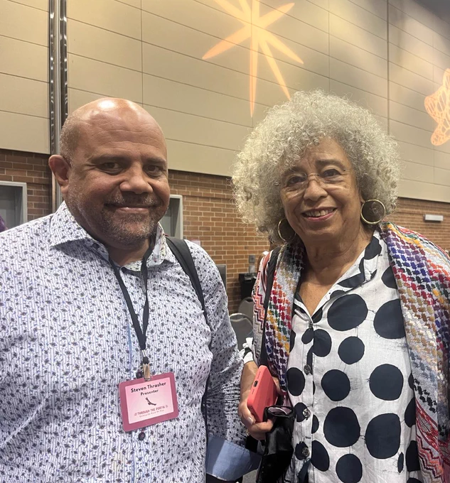 Steven Thrasher and Angela Davis smiling