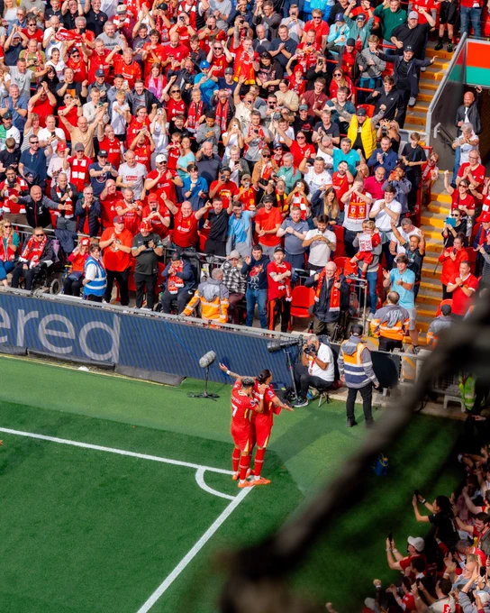 Darwin Nunez and Luis Diaz celebrate in front of the Anfield Road end