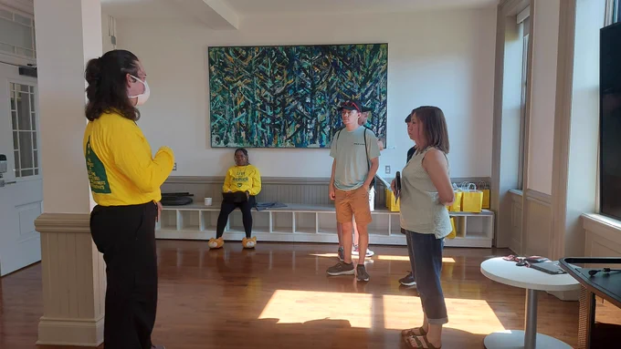 A family taking a residence hall tour of the Thompson Home