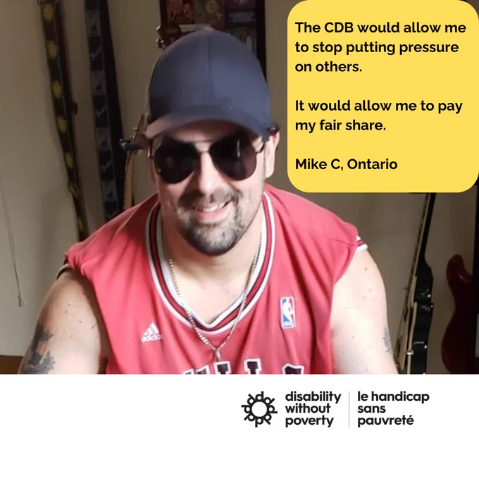 A white man with a goatee wearing a plain black baseball cap, sunglasses and a red Chicago Bulls jersey holding an electric guitar.

Speech bubble with text: The CDB would allow me to stop putting pressure on others. It would allow me to pay my fair share. Mike C., Ontario