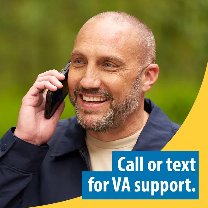 A Veteran standing outside talking on their cell phone with text that says, “Call or text for VA support.” 
