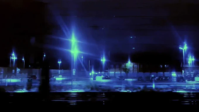 colour video still showing railway station at night