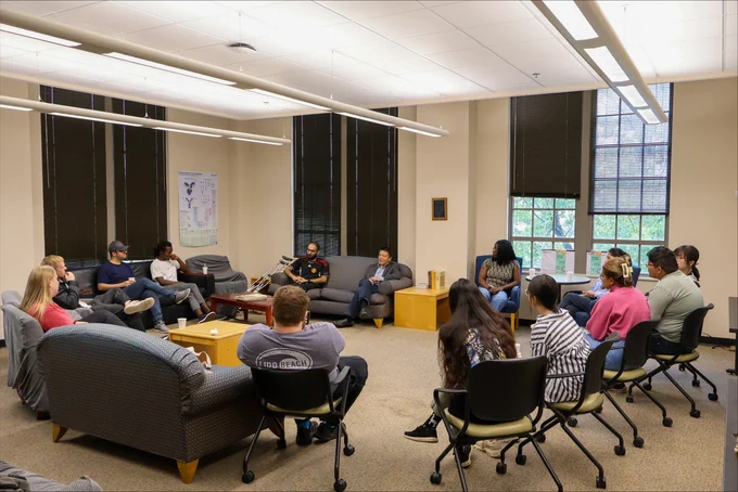 Prof. Bo Zhang (U Washington chemistry) chats with a graduate students.