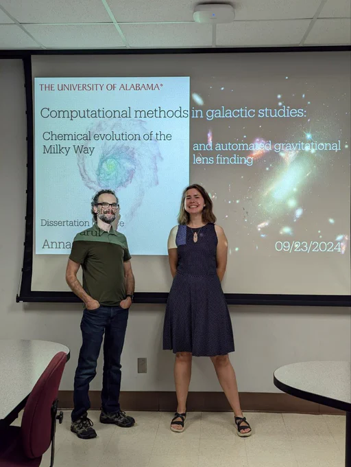 A beaming Anna Parul (right) and proud advisor Jeremy Bailin (left) in front of the title slide of her dissertation talk "Computational methods in galactic studies: Chemical evolution of the Milky Way and automated gravitational lens finding".