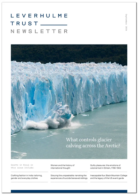 September Newsletter cover: a large chunk of ice breaks off a glacier crashing into the sea, creating a huge splash.