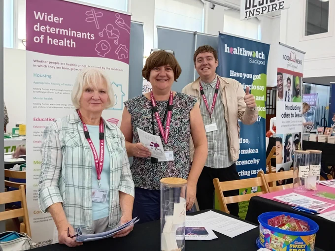 Group of co-researchers at a stall for a local college Freshers Fair