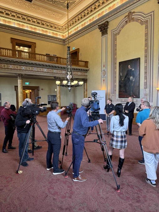 Media with Premier and other speakers at the announcement.