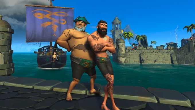 Two pirates pose on a dock wearing black underwear and a green belt. Behind them sits a sloop with a symbol of a yellow snake on it.