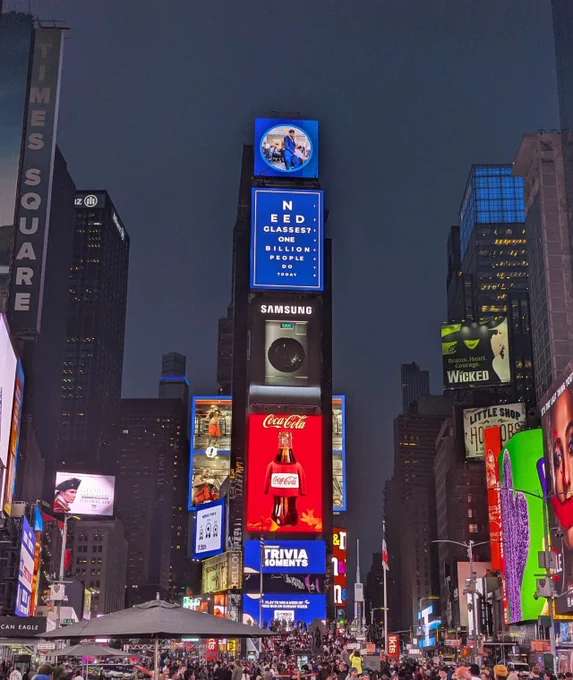 Photos of Unlock The Everyday activation in Times Square NY,, Monday 23 September. The photos capture viewers watching the campaign projections on Times Square Billboards.