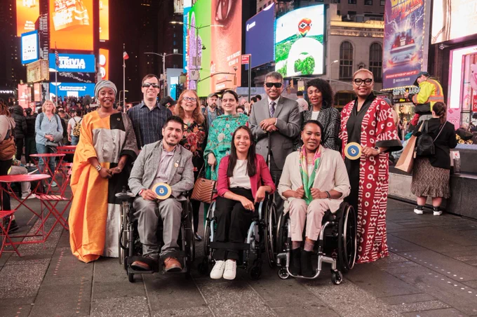 Photos of Unlock The Everyday activation in Times Square NY,, Monday 23 September. The photos capture viewers watching the campaign projections on Times Square Billboards.