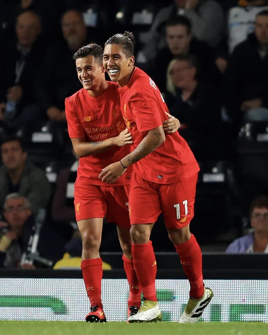 Coutinho and Firmino celebrate a goal against Derby County in 2016.